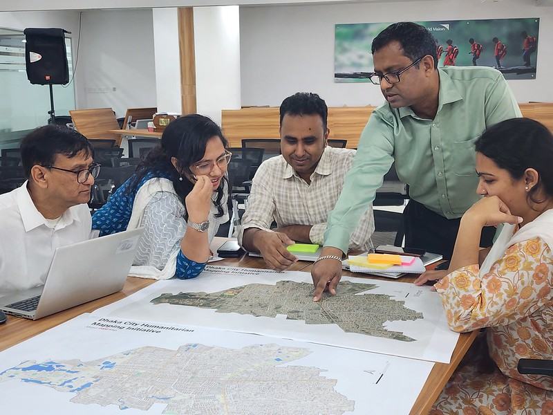 Stakeholders pointing at a print map