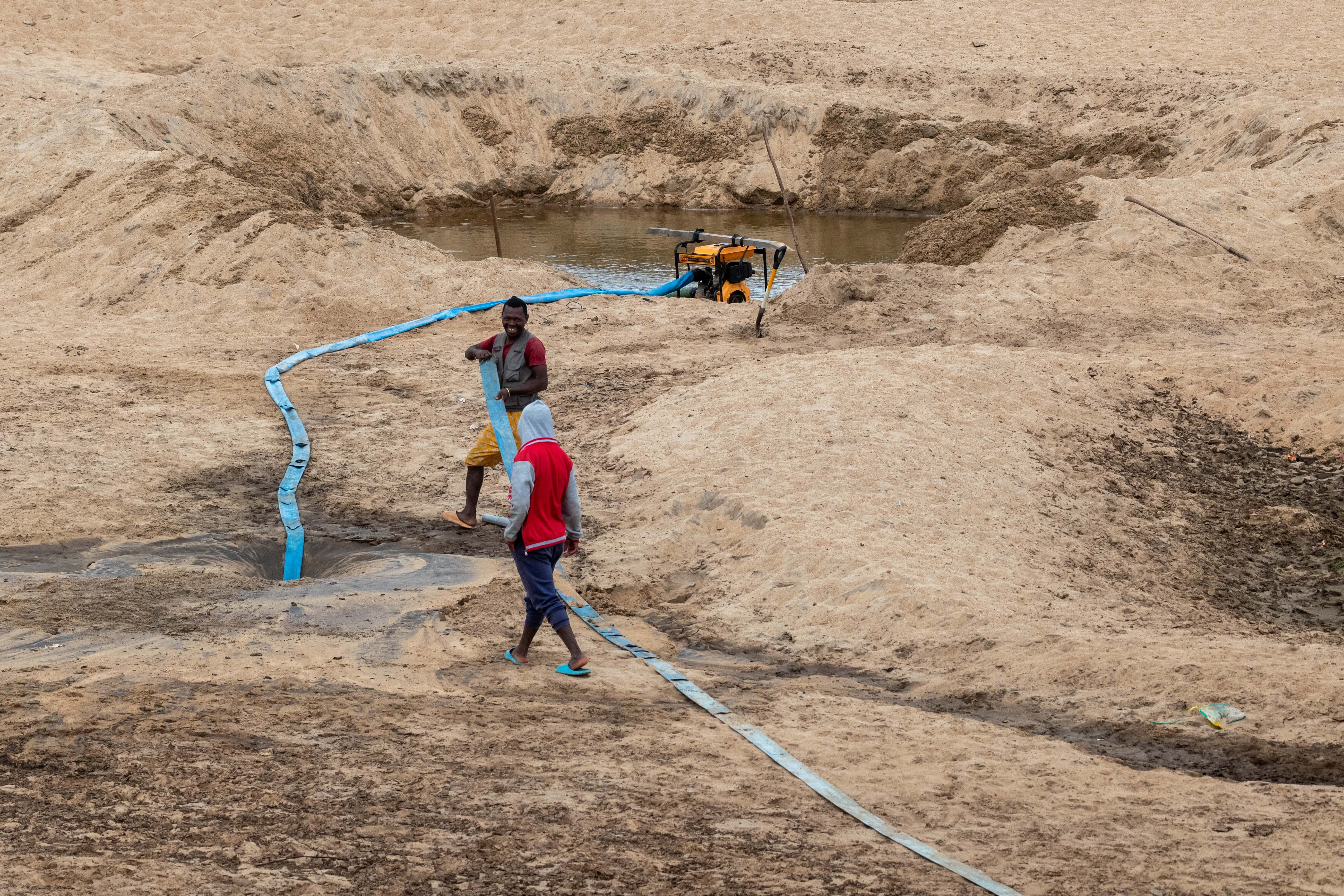 Shallow well dug in the river bed during dry season